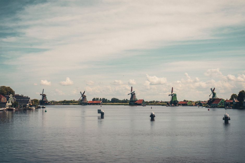 Breathtaking panorama of traditional windmills on a clear day at Zaanse Schans, Netherlands.